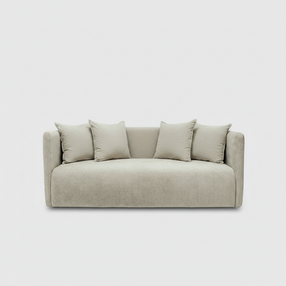 Beige sofa with four cushions on a light gray background