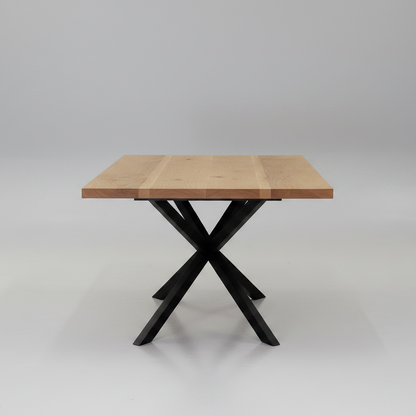 Wooden table with black metal legs on a white background