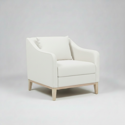 White armchair on a gray background