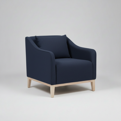 Gray armchair with wooden legs on a light gray background