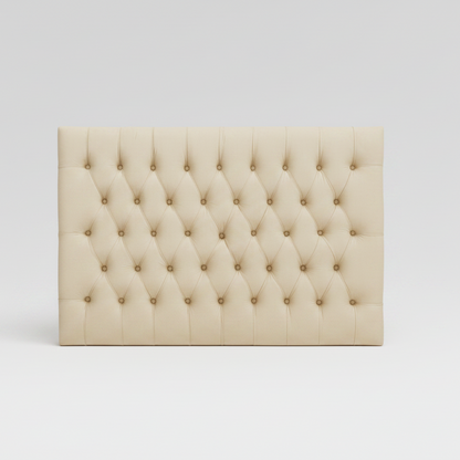 Beige tufted headboard on a white background
