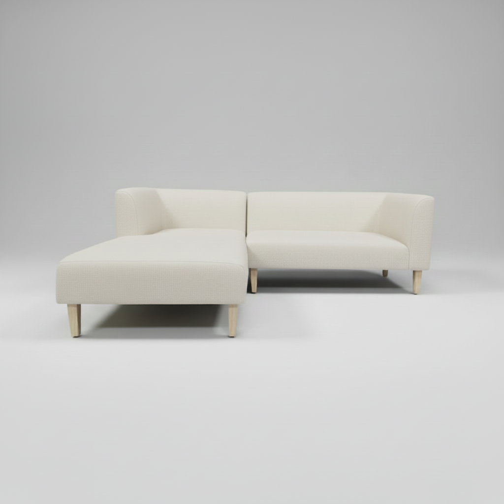 White sectional sofa on a gray background