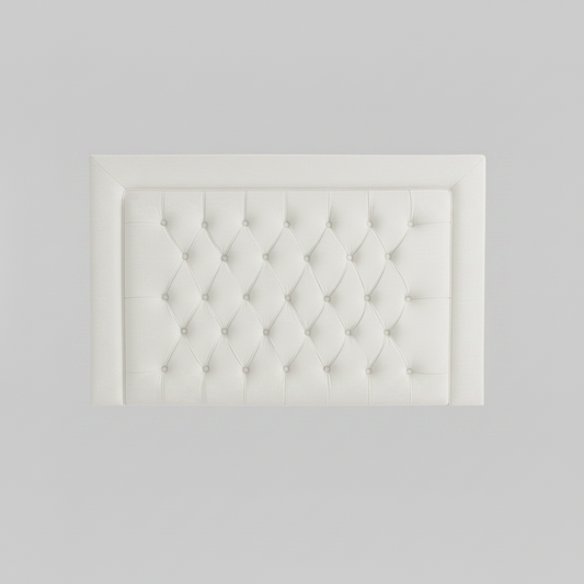 Black tufted headboard on a white background