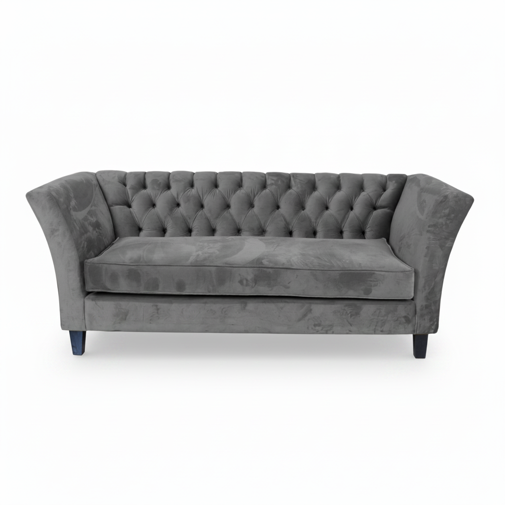 Gray tufted sofa on a white background