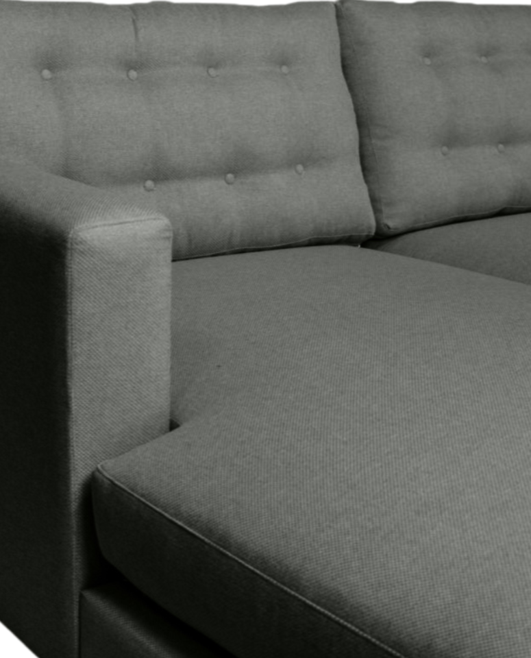 Side view of the Lisa L-Shaped Daybed, showcasing its button-detail cushions and modern design.