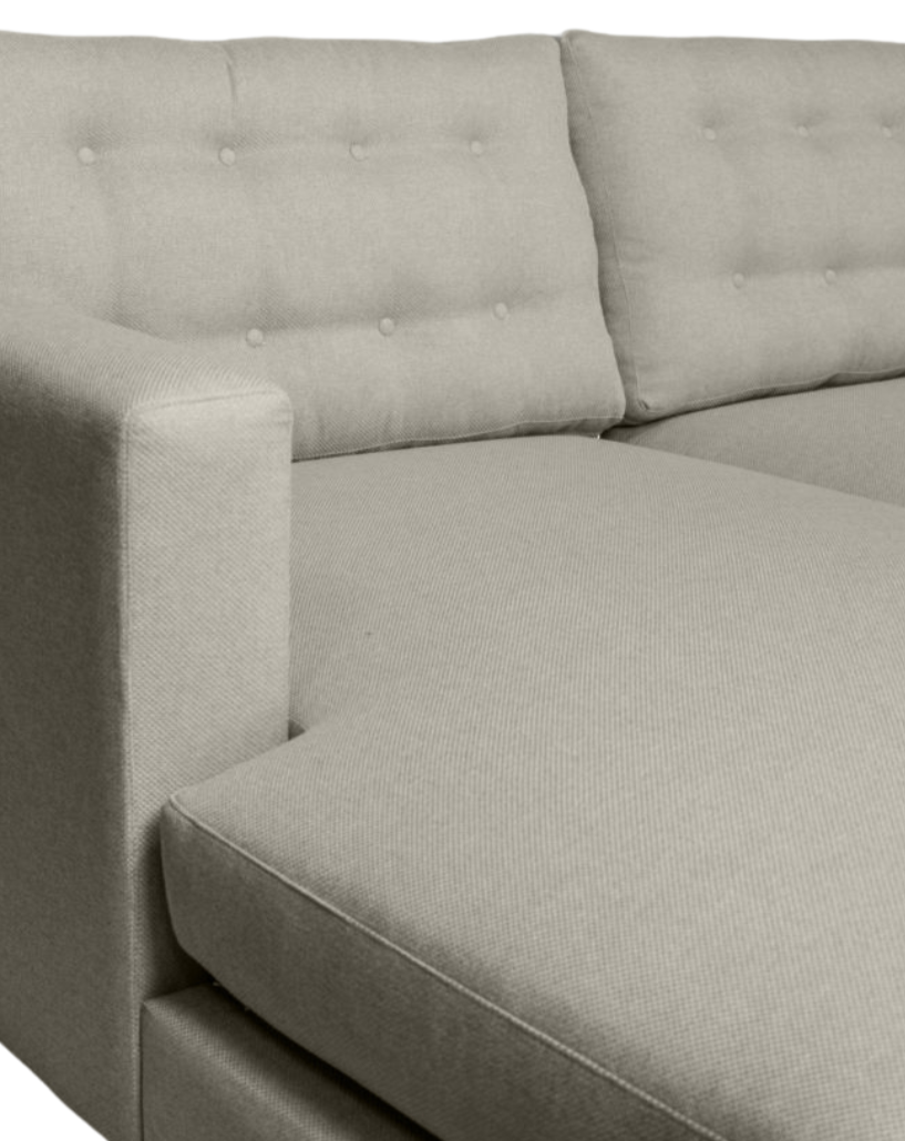 Side view of the Lisa L-Shaped Daybed, showcasing its button-detail cushions and modern design.