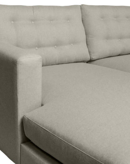 Side view of the Lisa L-Shaped Daybed, showcasing its button-detail cushions and modern design.
