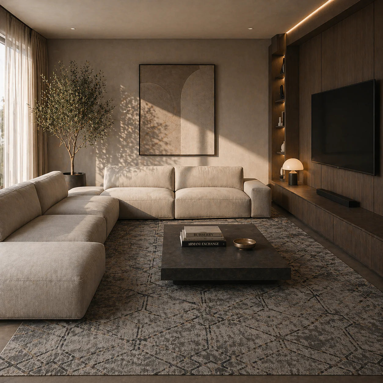 A modern living room featuring a large beige sectional sofa, a dark wood coffee table, a patterned gray rug, and a wall-mounted flat-screen TV in a warm, minimalist interior.