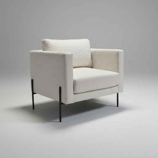 White armchair on a gray background