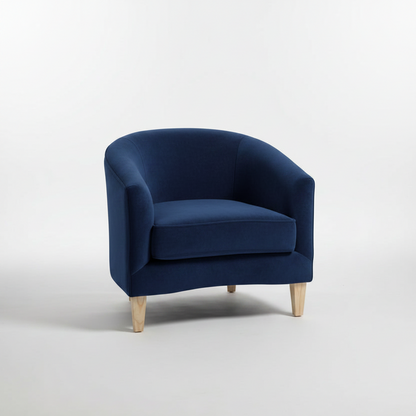 Navy blue armchair with wooden legs on a white background