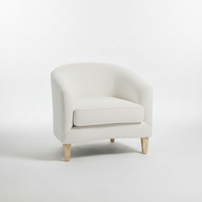Navy blue armchair with wooden legs on a white background