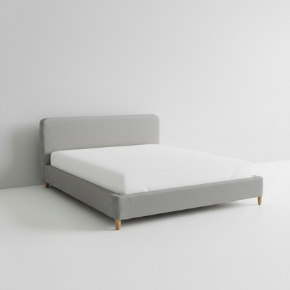 White bed with a white mattress on a plain background