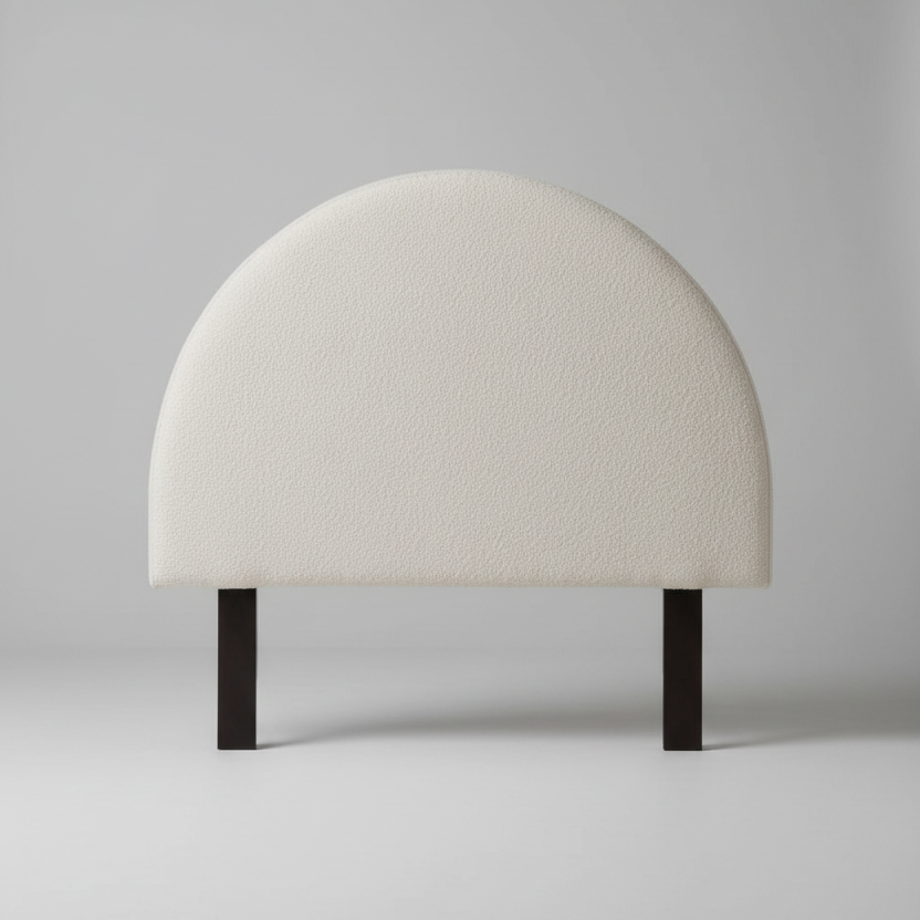 White dome-shaped headboard with black legs on a light gray background