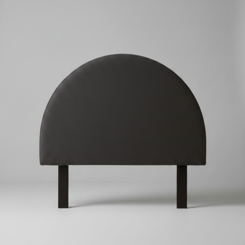 Black half-moon-shaped object on a gray background