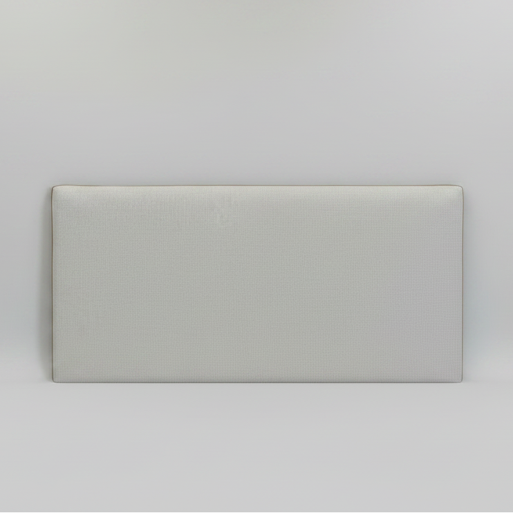 Headboard with leather detail on a light grey background