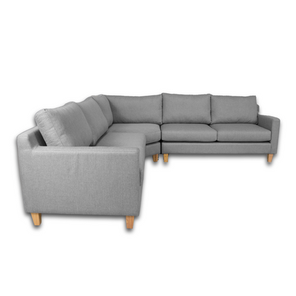 Side view of the Ryan L-Shaped Corner Couch, showcasing its wooden legs and modern design.