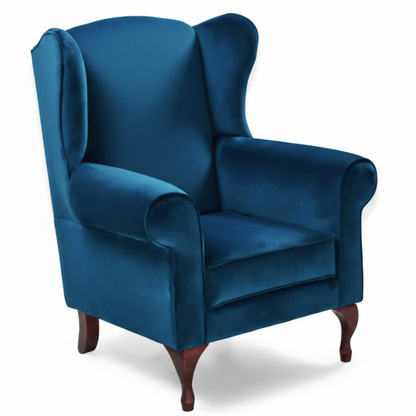 Blue wingback chair on a white background