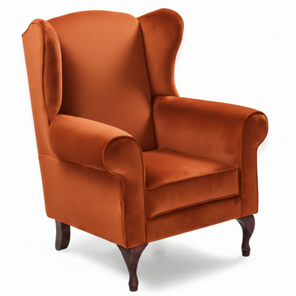 Orange wingback chair on a white background