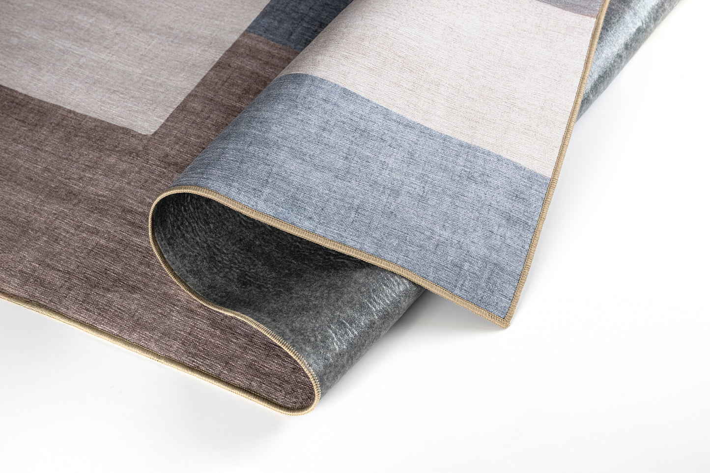 Roll of patterned carpet with geometric design on a white background