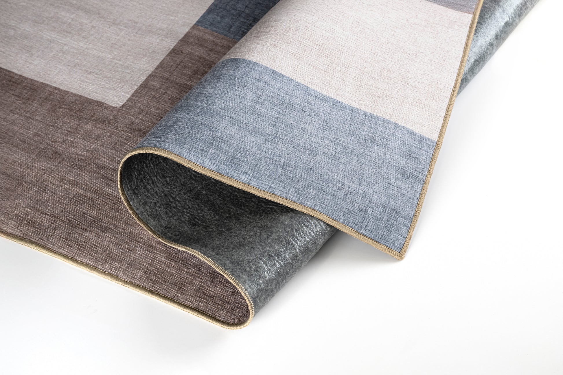 Roll of patterned carpet with geometric design on a white background