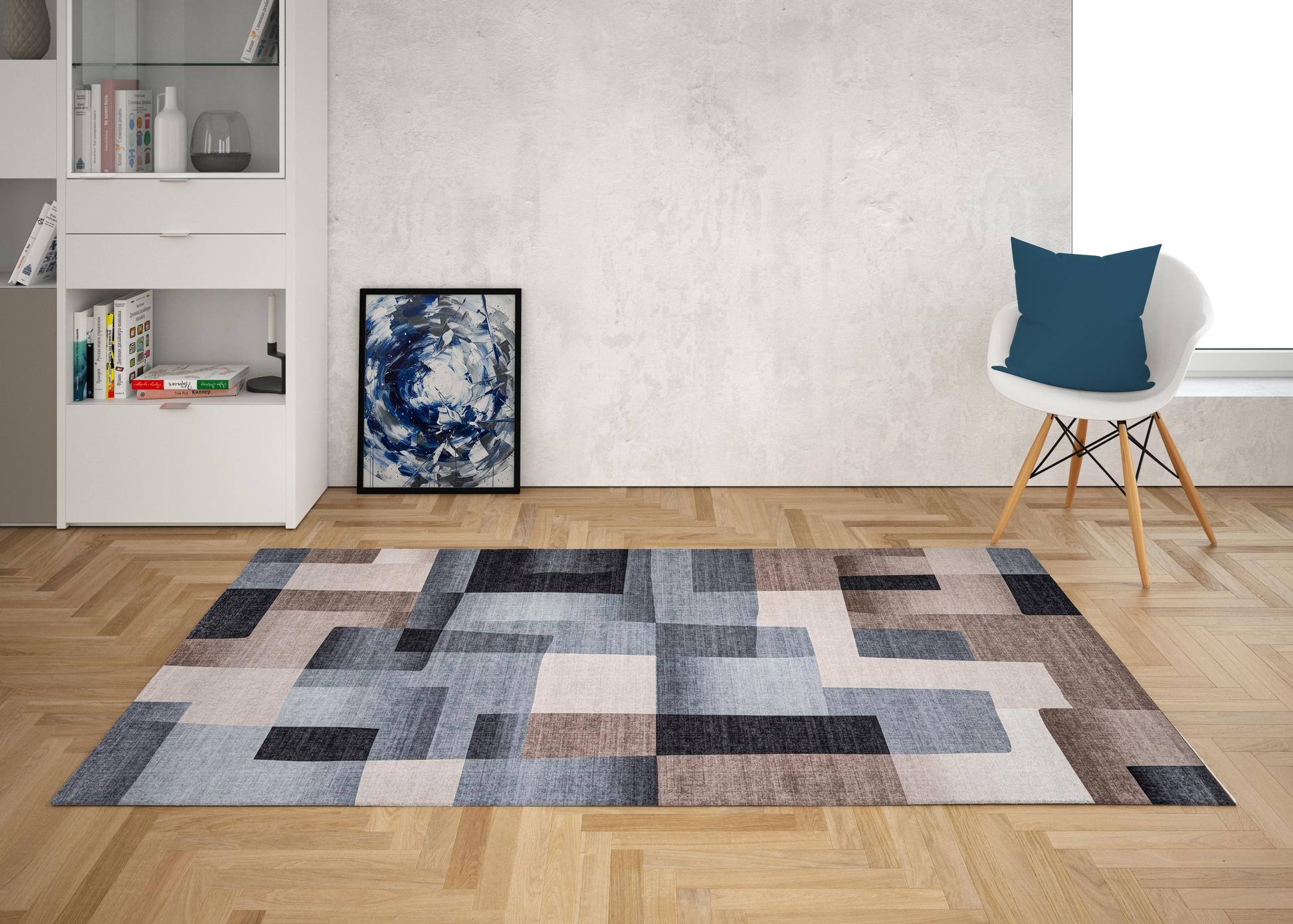 Modern living room with a geometric patterned rug, white chair, and abstract art on the wall.