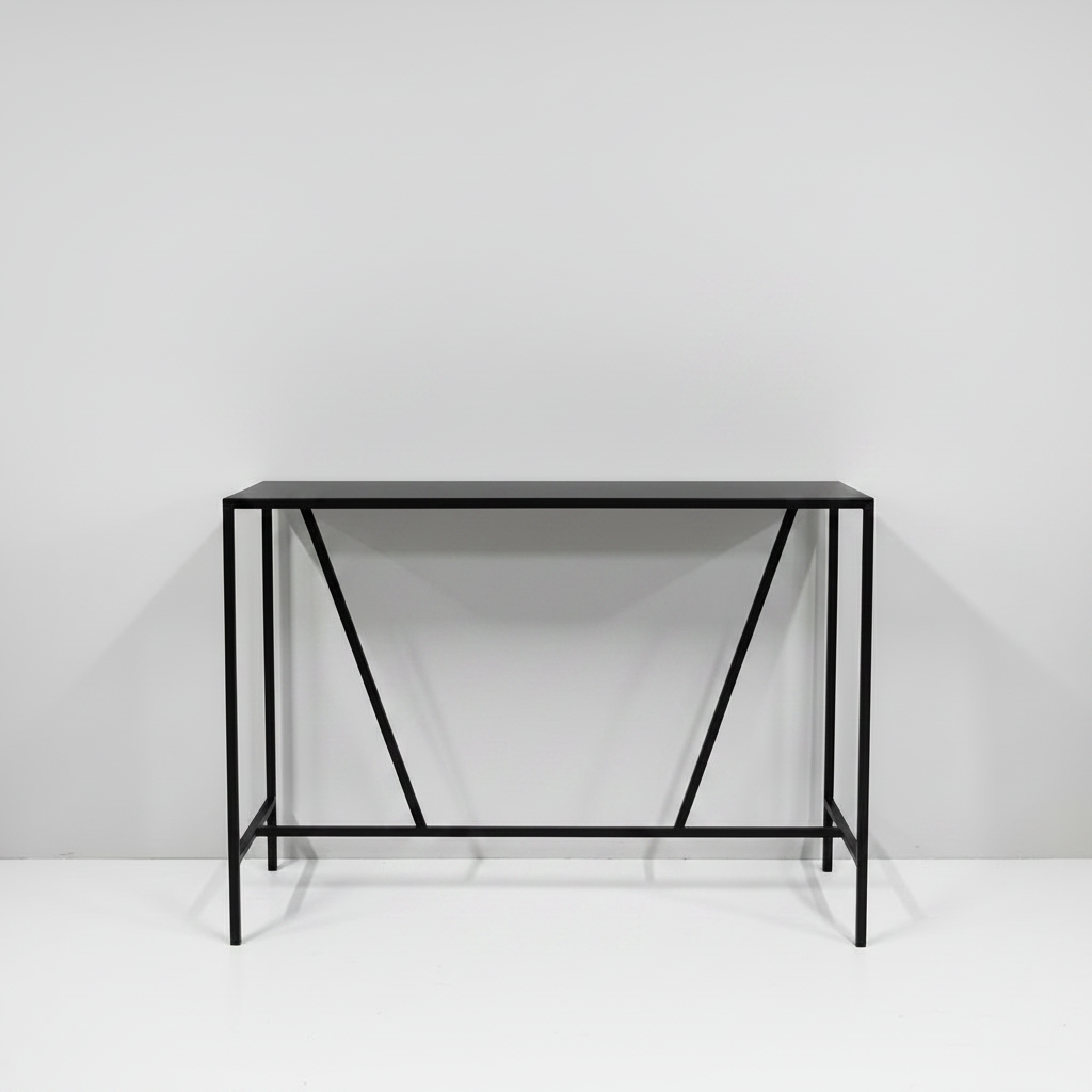 Black metal console table against a white wall