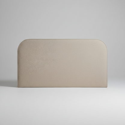 Beige upholstered headboard with a white pillow on a light gray background