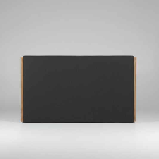 Black upholstered headboard with wooden sides on a gray background
