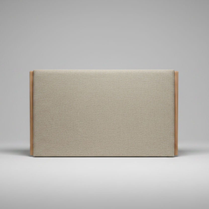 Upholstered headboard with wooden frame on a grey background