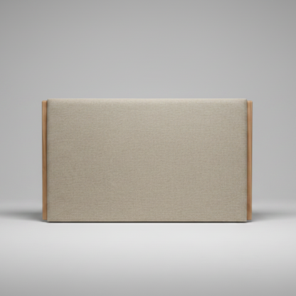 Upholstered headboard with wooden frame on a grey background