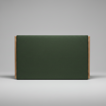 Green upholstered headboard with wooden sides on a gray background