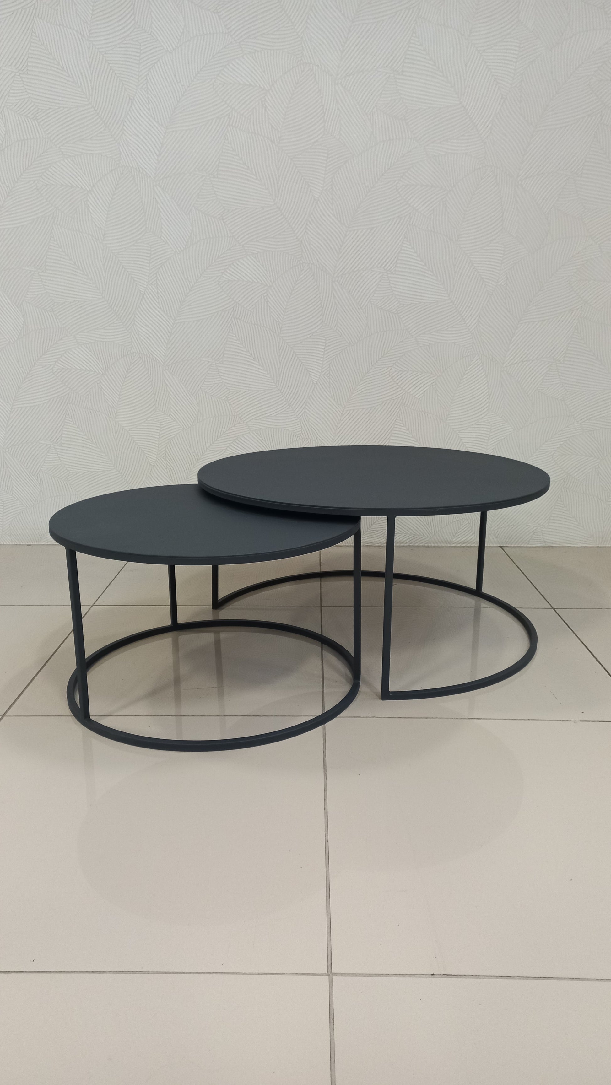 leek Black Round Nesting Table Set crafted from black epoxy-coated steel.