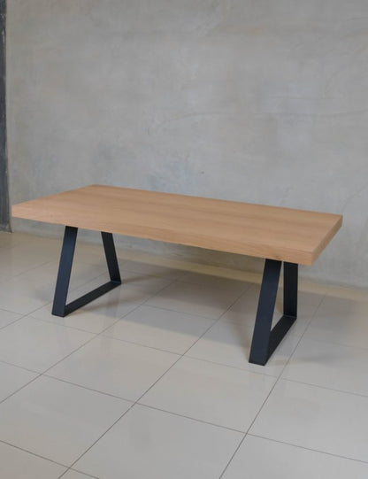 Modern oak veneer dining table, ideal for stylish family dining rooms.