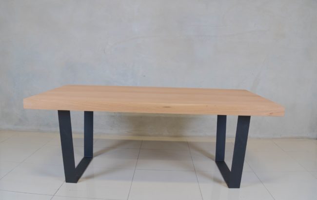 Holtz Dining Table with oak veneer top and modern black epoxy-coated steel base.