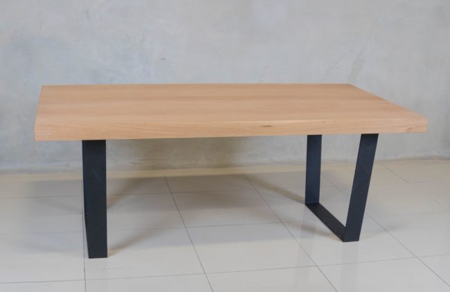 Holtz Dining Table with oak veneer top and modern black epoxy-coated steel base.