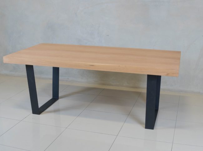Holtz Dining Table with oak veneer top and modern black epoxy-coated steel base.