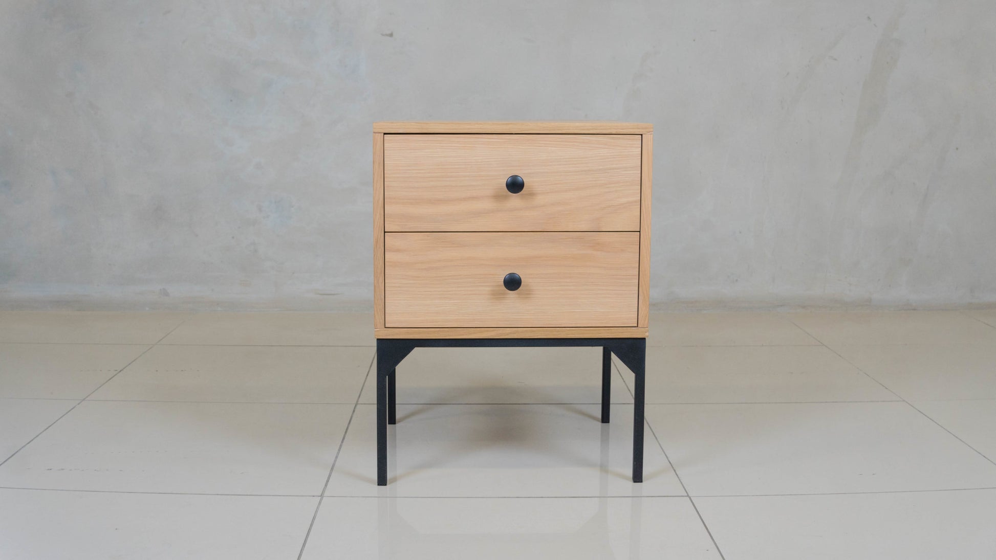 Modern oak veneer bedside table with two spacious drawers and ball-bearing runners.