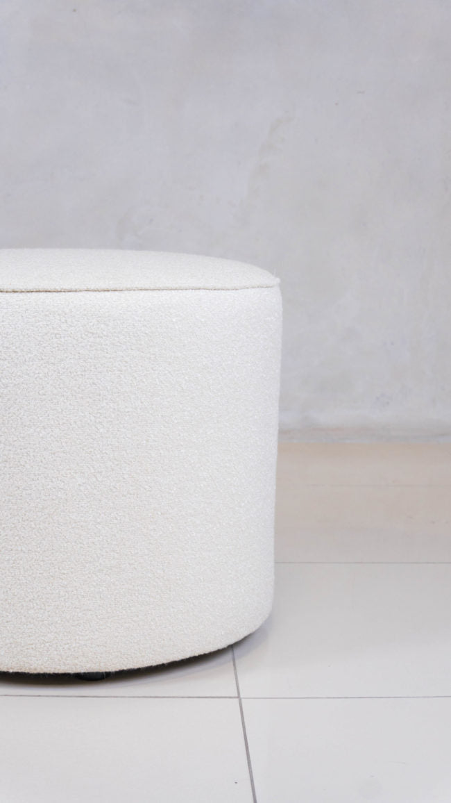 Small Shaun Ottoman with custom fabric upholstery.