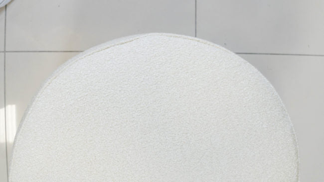 Small Shaun Ottoman with custom fabric upholstery.