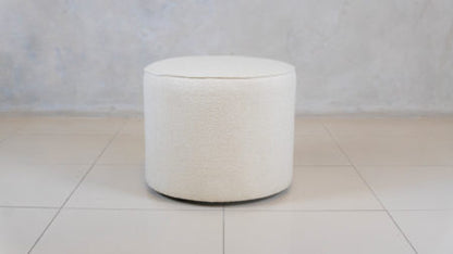 Compact upholstered ottoman, locally handcrafted.
