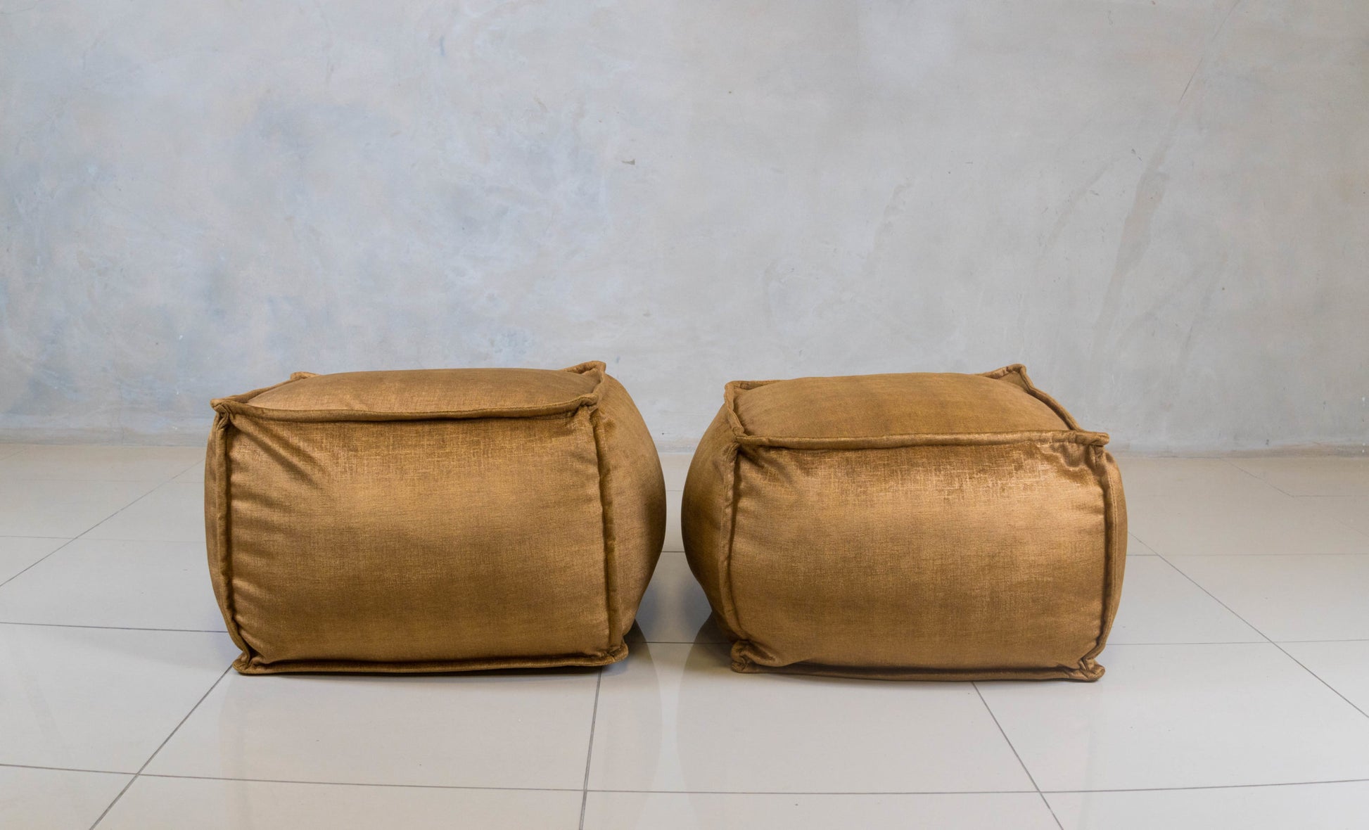 Mouf Floor Ottoman – small, upholstered and decorative.

