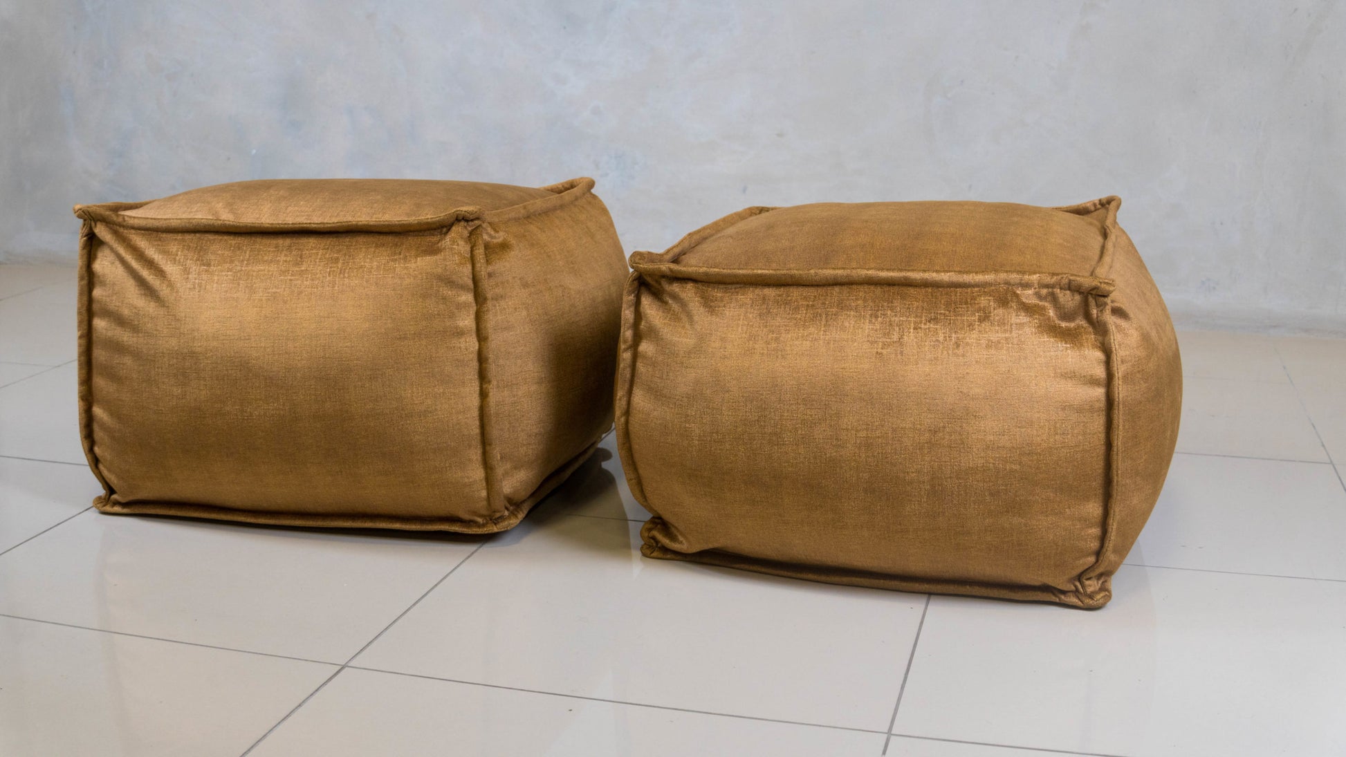 Mouf Floor Ottoman – small, upholstered and decorative.