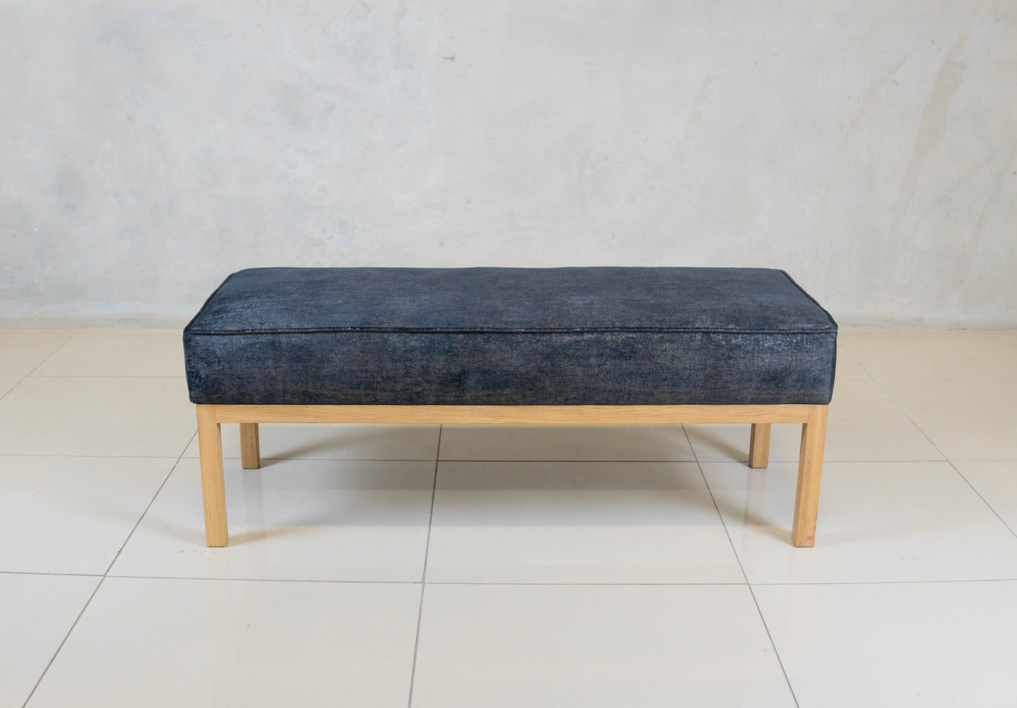 Bevery Ottoman with solid oak base and upholstered seat.

