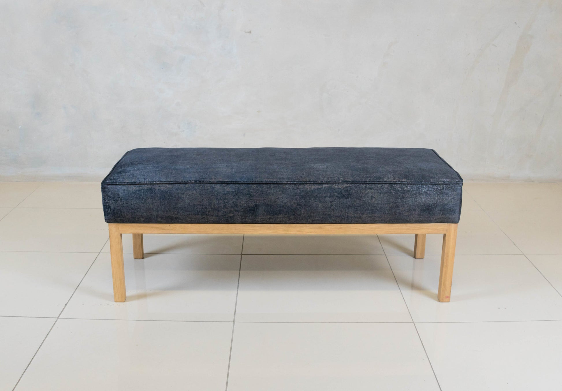 Bevery Ottoman with solid oak base and upholstered seat.

