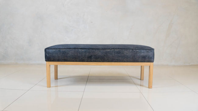 Bevery Ottoman with solid oak base and upholstered seat.

