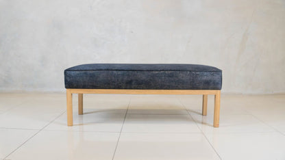Bevery Ottoman with solid oak base and upholstered seat.

