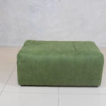 Trout Block Ottoman with fluted sides and upholstered top.