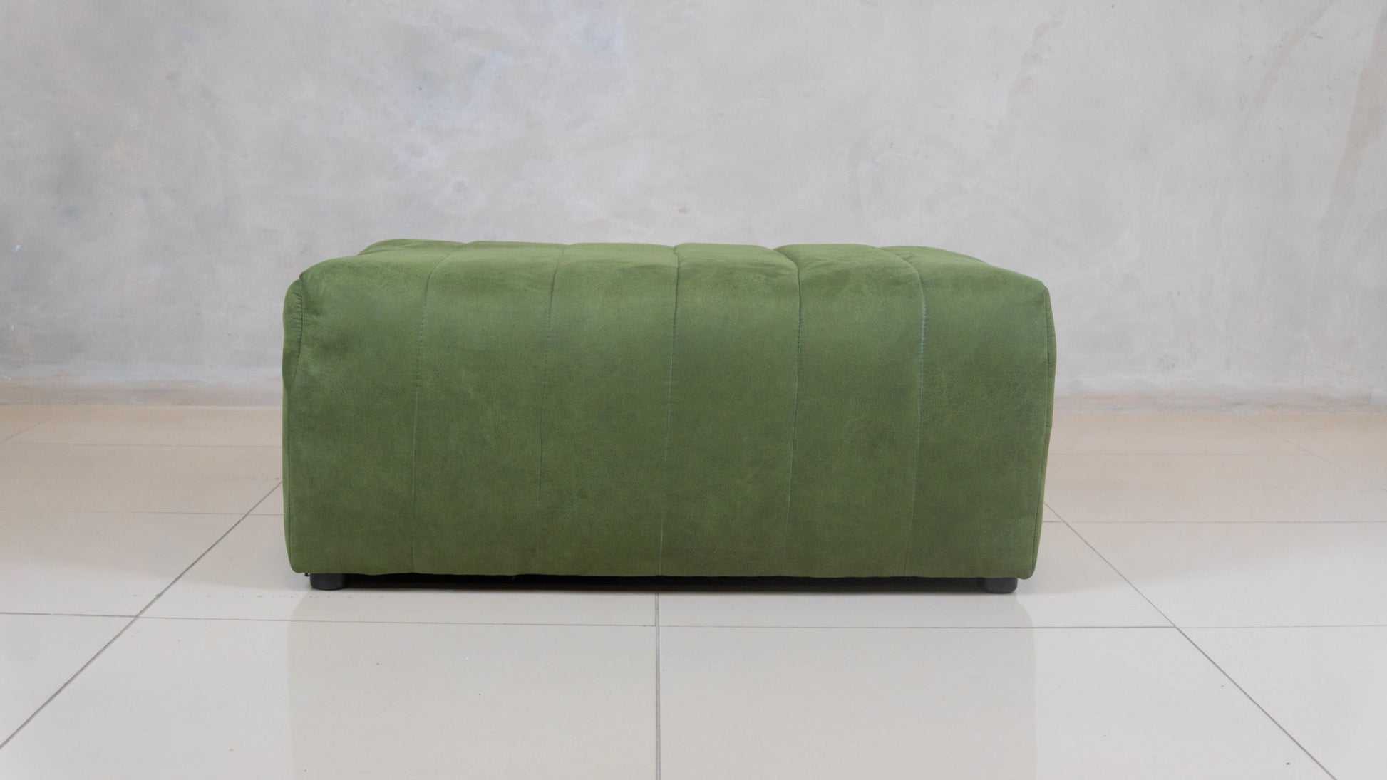 Trout Block Ottoman with fluted sides and upholstered top.