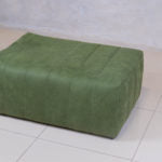 Trout Block Ottoman with fluted sides and upholstered top.