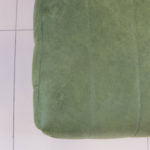 Trout Block Ottoman with fluted sides and upholstered top.